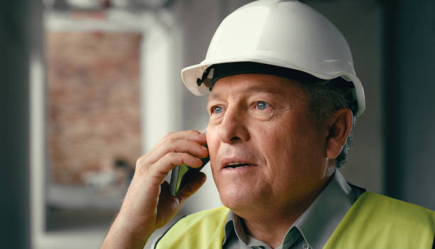 istock Construction, phone call and portrait of engineer in building talking on smartphone. Architect, inspector or contractor with phone on site, tech communication and conversation for construction worker 1438431505