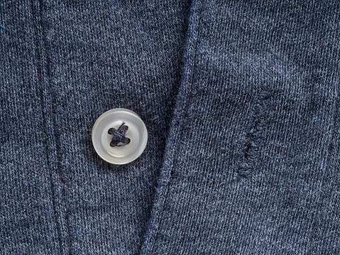 Buttons on a sleeve of a black man's suit