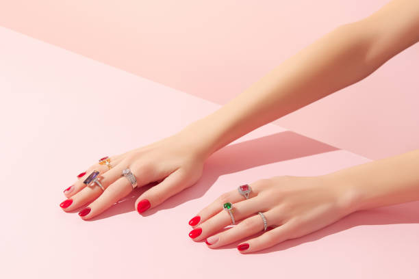 istock Womans hand with rinds on pink background 1438433544
