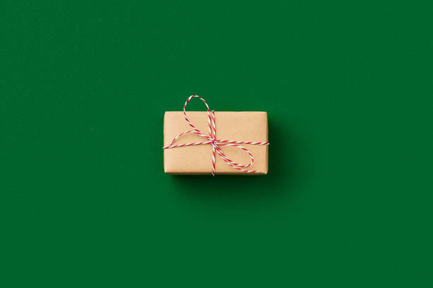 istock Christmas celebration concept. Gift on green background 1438435319