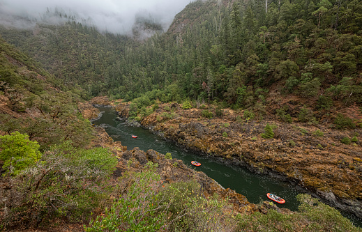 Rafting down the Rogue River in southern Oregon.  The  Rogue was one of the original eight rivers named in the Wild and Scenic Rivers Act of 1968.