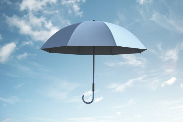 A blue umbrella soaring in the sky