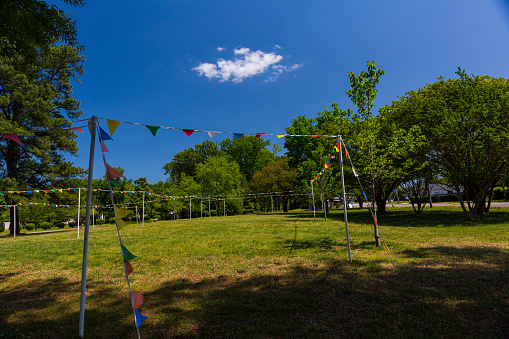 Park with colorful flags on string