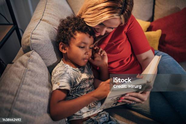 Mother And Son Reading Stories Stock Photo - Download Image Now - Reading, Mother, Child