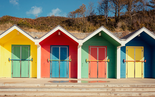 ordinary multicolored  changing rooms on the beach in England