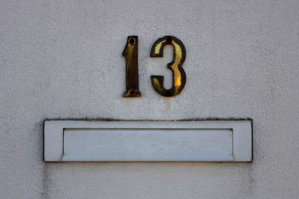 istock Wall mailbox and the number 13 (thirteen) on house exterior 1438446808