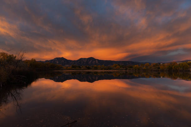 istock Wide-angle sunrise, mountains, and a lake reflection 1438447995