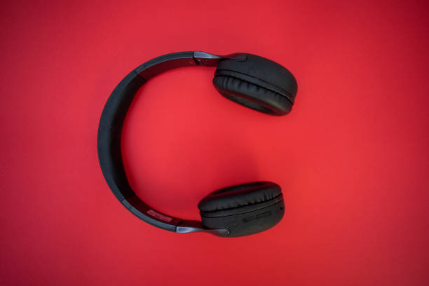istock headphones on red background 1438450581