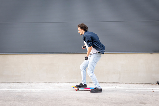 Man with skateboard in the city. Urban lifestyle.
