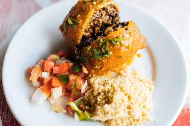 Buchada - a Brazilian stew made with goat entrails. Buchada with vinaigrette and farofa