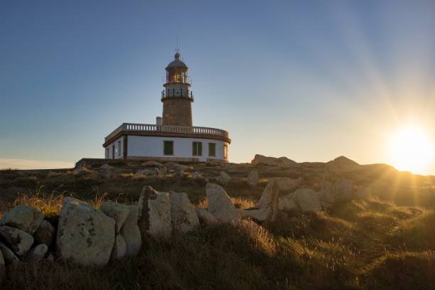 istock Corrubedo lighthouse surrounded by rocks and grass under the sunlight in Spain 1438453718