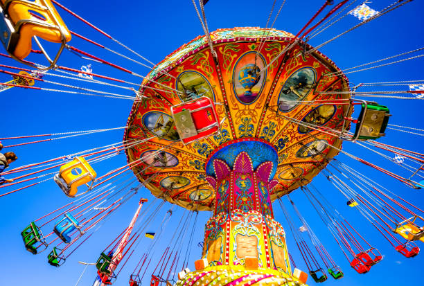 typical ride at the oktoberfest in munich Munich, Germany - September 22:Typical ride at the Oktoberfest (the world's largest folk festival) in Munich on September 22, 2022 fairground ride stock pictures, royalty-free photos & images