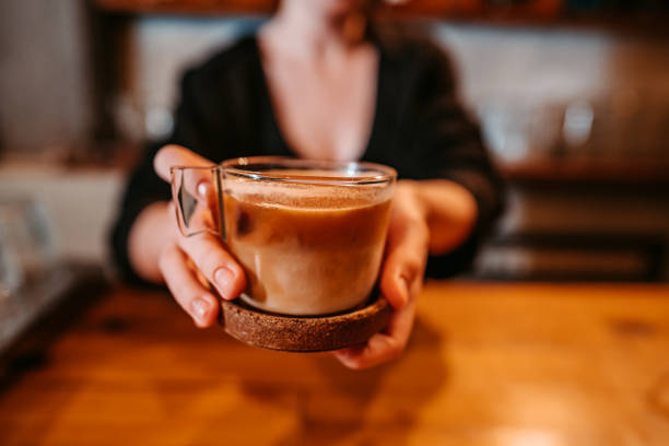 istock Barista Serving A Cup Of Coffee 1438454460