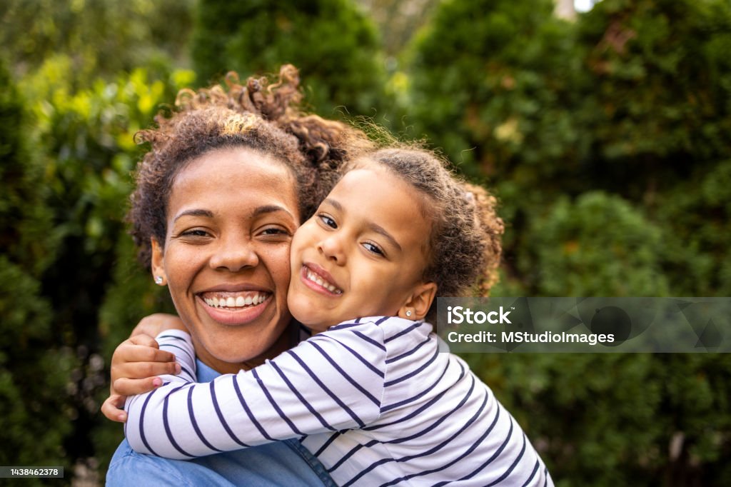 Close up portrait of mother and daughter Portrait of happy mother and daughter Family Stock Photo