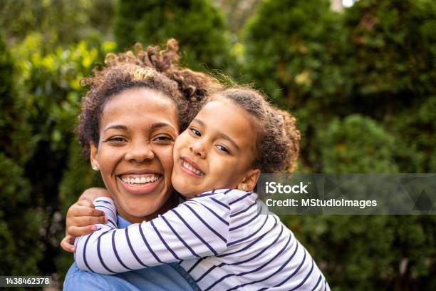 Close Up Portrait Of Mother And Daughter Stock Photo - Download Image Now - Family, Child, Mother