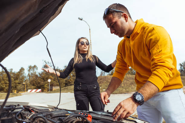 istock Couple arguing about car problem, people disagree, quarrel on the road 1438463785