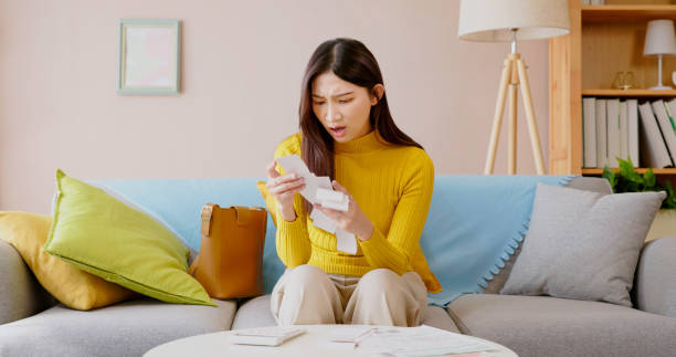 istock woman calculating bills 1438467405