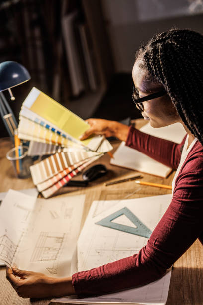 istock Architect designing a project and choosing color swatches for it 1438467936