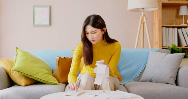 istock woman calculating bills 1438467961