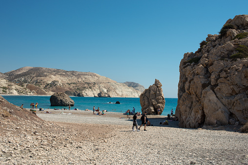 Paphos, Cyprus - Oct 13, 2022: Aphrodite's Rock, or Petra tou Romiou, is one of the major tourism attractions on the island as the birthplace of the Greek goddess Aphrodite.
