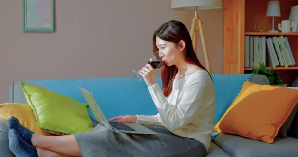 istock asian woman enjoying wine 1438468981