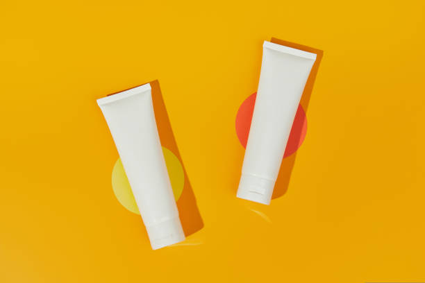 istock Lotion or cream set on orange background. Care products skincare routine 1438469855