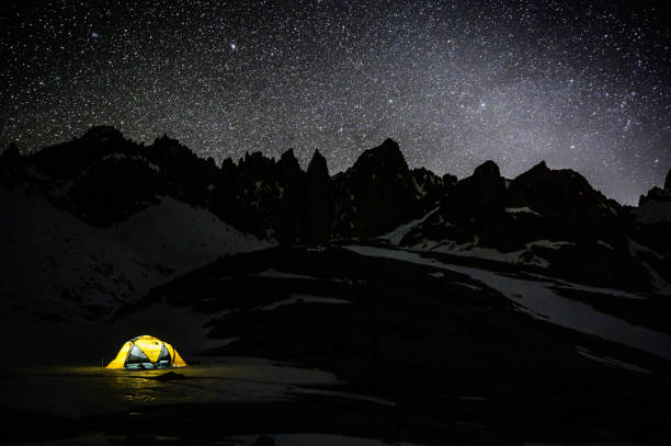istock Tent under stars and mountains 1438470674