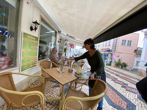 LAGOS,  Portugal - October 20,  2022.  People  enjoy there coffee and lunch break of in the city of Lagos.