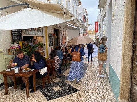 LAGOS,  Portugal - October 20,  2022.  People  enjoy there coffee and lunch break of in the city of Lagos.