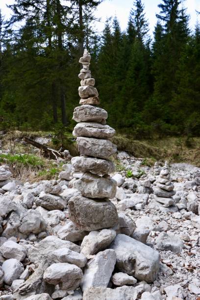 Zen-like Rock Pile Cairn Trail Marker - Rocks stacked marking hard to navigate area of hiking trail.