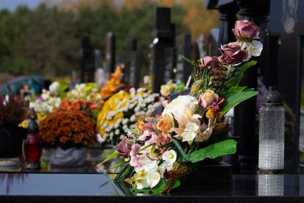 istock Flowers on the grave 1438473807