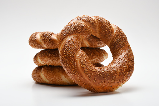 Group of Turkish bagel simit on the white background, sesame bagel