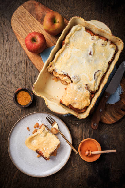 istock Homemade bread pudding breakfast casserole with apples and cinnamon and egg white frosting 1438475282