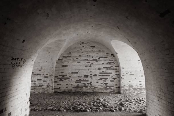 istock Arches in an old, historical building, grayscale, Lithuania 1438476103