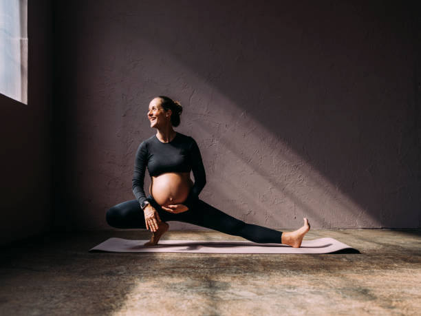 istock Mother To Be Exercising In The Gym 1438477876
