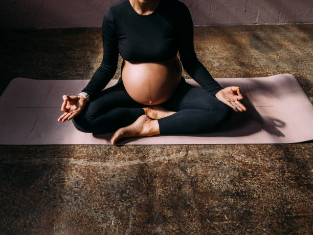 istock Anonymous Pregnant Woman Meditating 1438477890