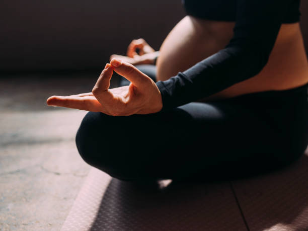 istock Anonymous Pregnant Woman Meditating 1438477892