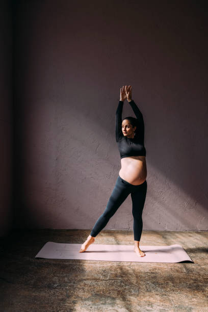 istock Mother To Be Exercising In The Gym 1438477915
