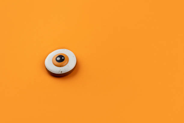 istock Halloween homemade gingerbread on orange background with copy space 1438478704