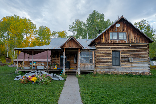 Rustic Old Ranch House Log Cabin with Picket Fence and Manicured Yard in Southwestern Colorado Near Telluride