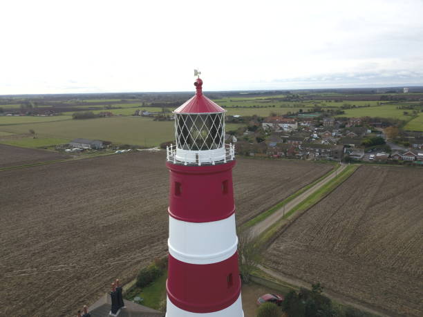 istock Light house the coastline that is erroading the fastest 1438482654