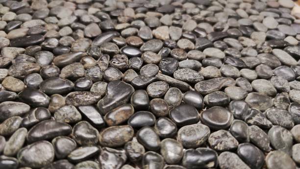 istock White and grey pebble stone texture wall as a background 1438482812