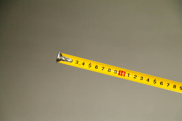 istock Yellow centimeter tape measure on neutral background. 1438482972