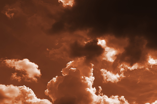 Abstract of cloud shapes and textures in orange tones
