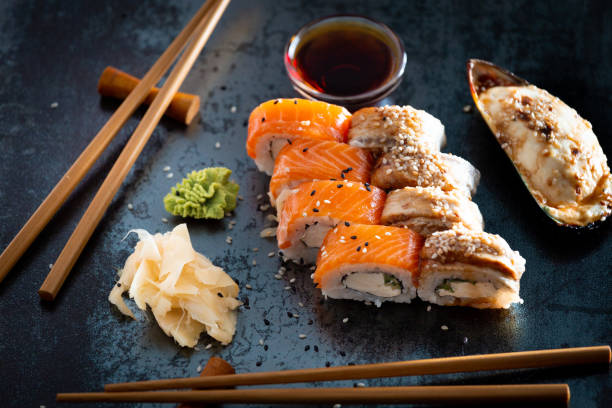 istock close up of sushi rolls on black tray 1438489657