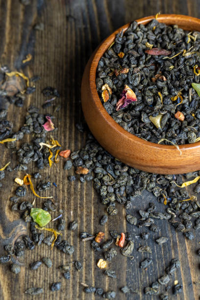istock Dried large-leaf green tea with pieces of fruit 1438489910