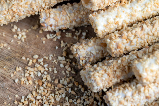 istock waffle tube with chocolate filling and crushed peanuts 1438489913