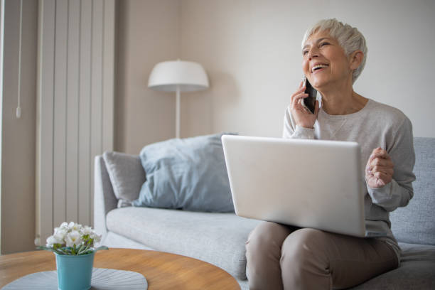 istock Senior woman working from home 1438494918