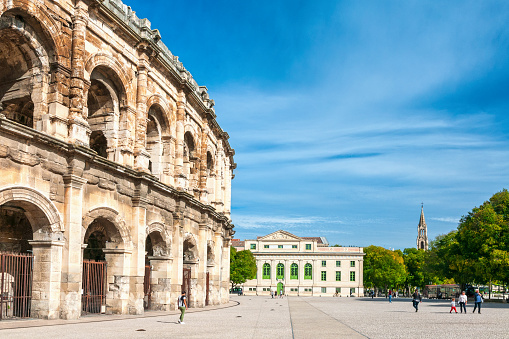 View on the roman amphitheatre in the centre of Nîmes city, in France. October, 25, 2022.