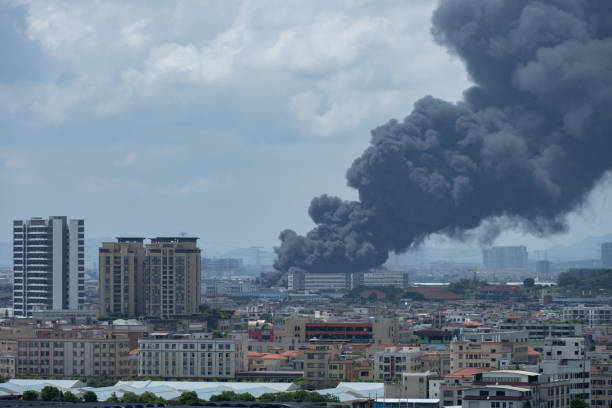 istock a factory catched a fire with lots dark smoke 1438499457